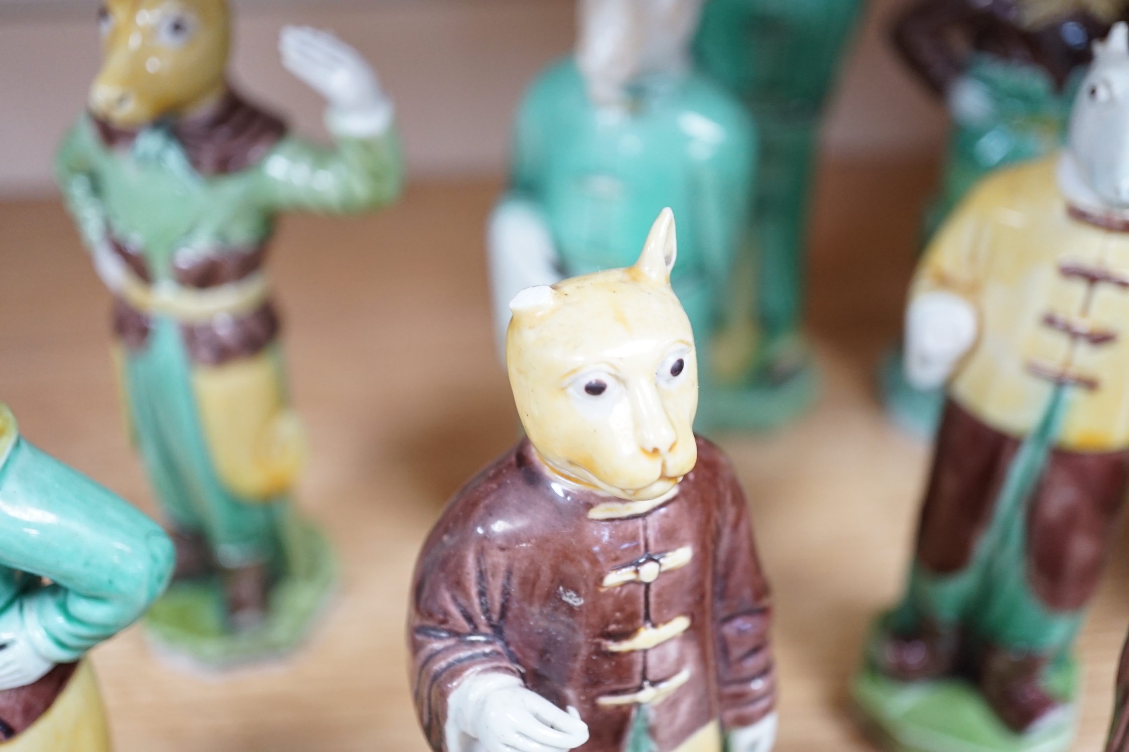 Ten Chinese Sancai glazed biscuit animal headed figures, tallest 17cm